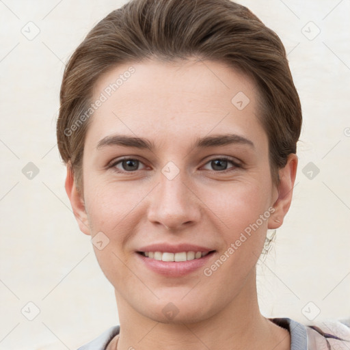 Joyful white young-adult female with short  brown hair and grey eyes