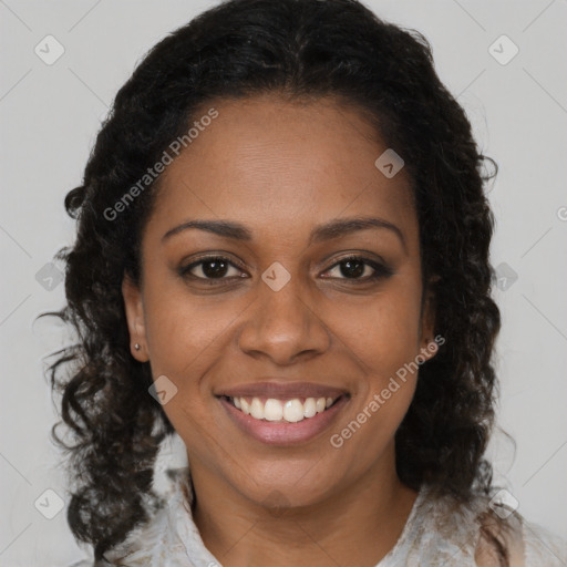 Joyful black young-adult female with medium  brown hair and brown eyes