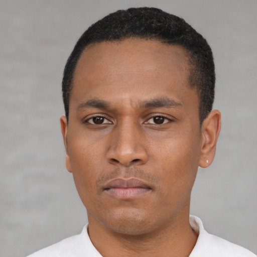 Neutral latino young-adult male with short  black hair and brown eyes