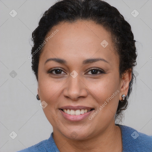 Joyful black adult female with short  brown hair and brown eyes