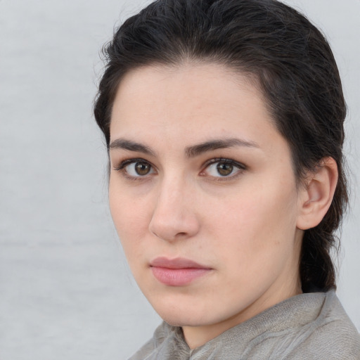 Neutral white young-adult female with medium  brown hair and brown eyes