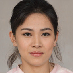 Joyful asian young-adult female with medium  brown hair and brown eyes