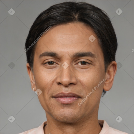 Joyful latino adult male with short  black hair and brown eyes