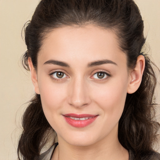 Joyful white young-adult female with long  brown hair and brown eyes