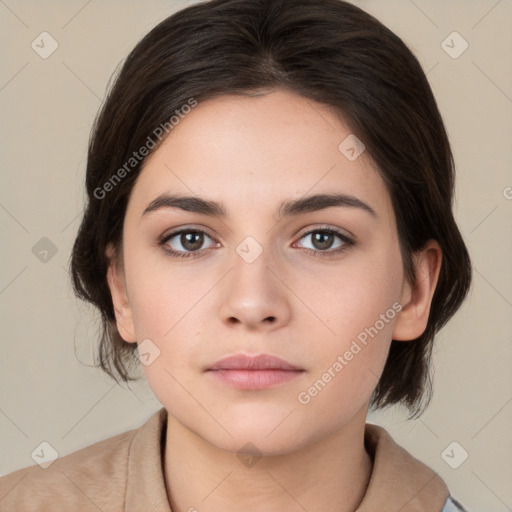 Neutral white young-adult female with medium  brown hair and brown eyes