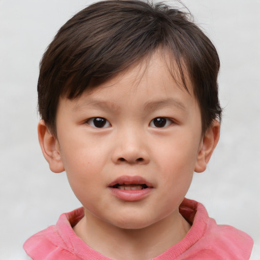 Joyful white child male with short  brown hair and brown eyes