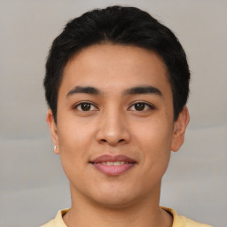 Joyful asian young-adult male with short  black hair and brown eyes