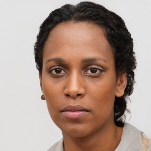 Neutral black young-adult female with short  black hair and brown eyes