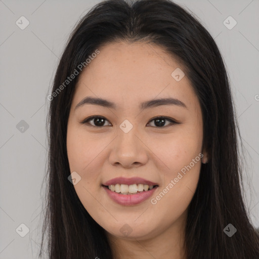 Joyful asian young-adult female with long  brown hair and brown eyes