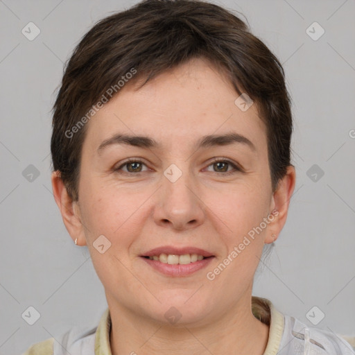 Joyful white young-adult female with short  brown hair and grey eyes