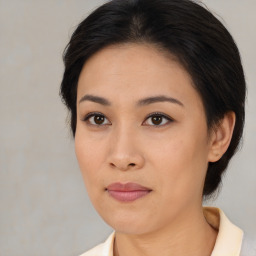 Joyful asian young-adult female with medium  brown hair and brown eyes