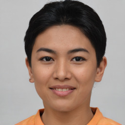 Joyful asian young-adult female with short  black hair and brown eyes