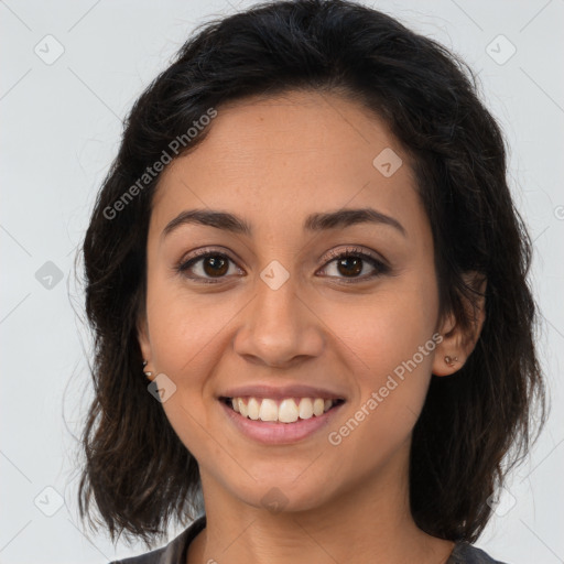 Joyful latino young-adult female with medium  brown hair and brown eyes