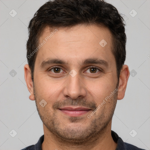 Joyful white adult male with short  brown hair and brown eyes