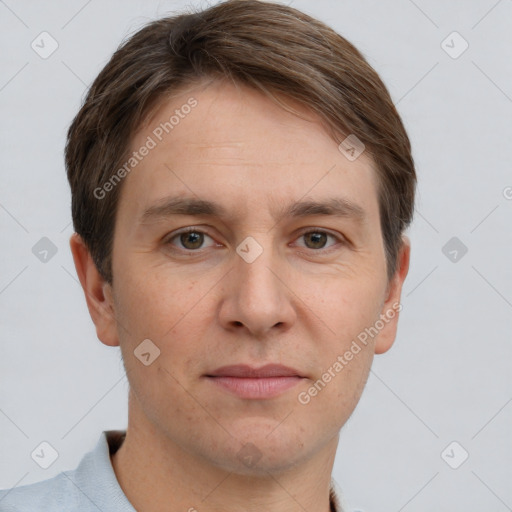 Joyful white adult male with short  brown hair and grey eyes