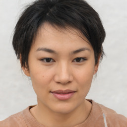 Joyful asian young-adult female with short  brown hair and brown eyes