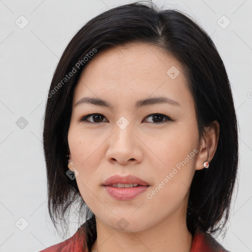 Joyful asian young-adult female with medium  black hair and brown eyes