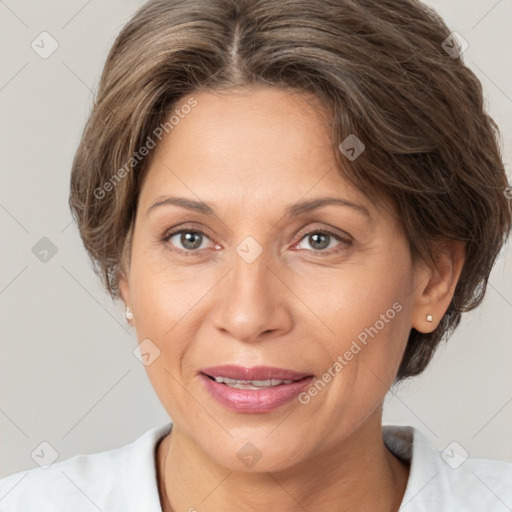 Joyful white adult female with short  brown hair and brown eyes