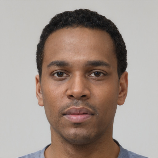 Neutral black young-adult male with short  black hair and brown eyes