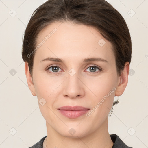 Joyful white young-adult female with short  brown hair and grey eyes