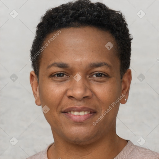 Joyful latino young-adult male with short  brown hair and brown eyes