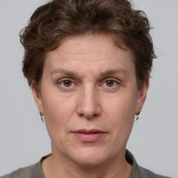 Joyful white adult female with short  brown hair and grey eyes