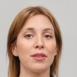 Joyful white young-adult female with medium  brown hair and blue eyes