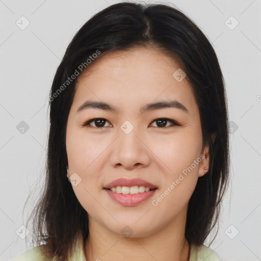 Joyful asian young-adult female with long  brown hair and brown eyes