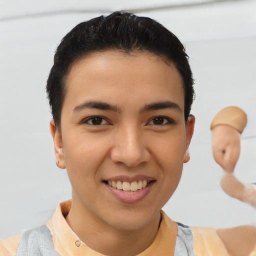 Joyful latino young-adult male with short  brown hair and brown eyes