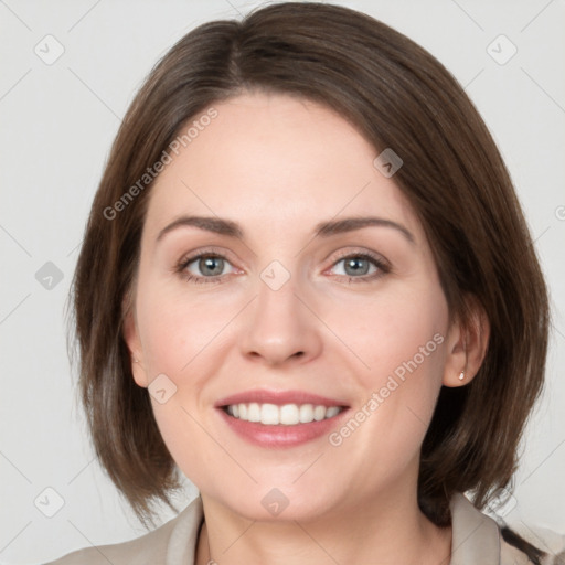 Joyful white young-adult female with medium  brown hair and grey eyes