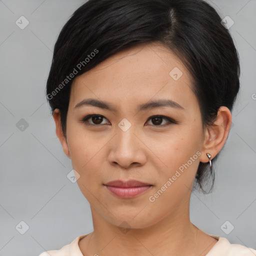 Joyful asian young-adult female with short  brown hair and brown eyes