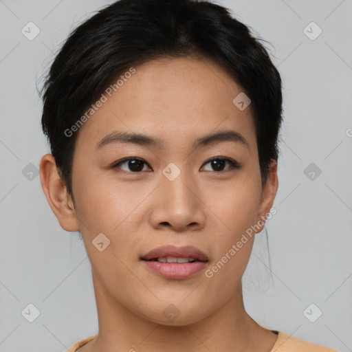 Joyful asian young-adult female with short  black hair and brown eyes