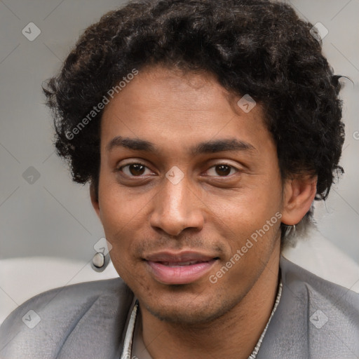 Joyful black young-adult male with short  brown hair and brown eyes