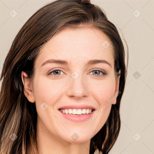 Joyful white young-adult female with long  brown hair and grey eyes