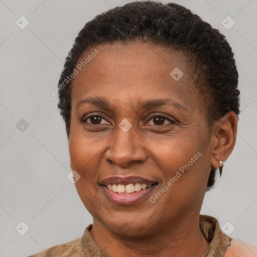 Joyful black adult female with short  brown hair and brown eyes