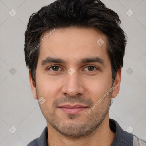 Joyful white young-adult male with short  black hair and brown eyes