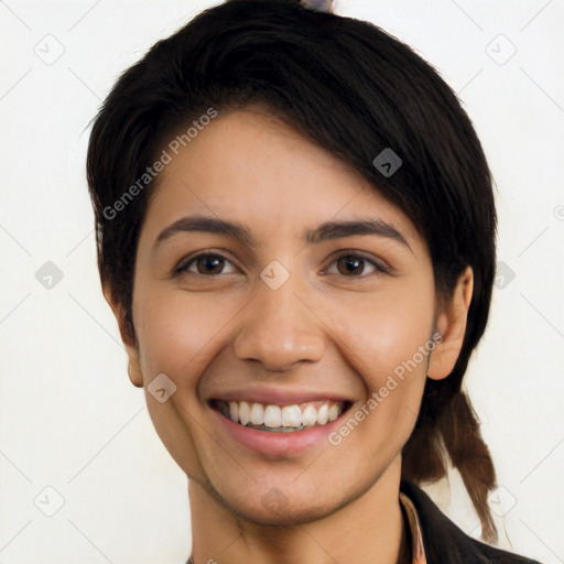 Joyful latino young-adult female with short  black hair and brown eyes