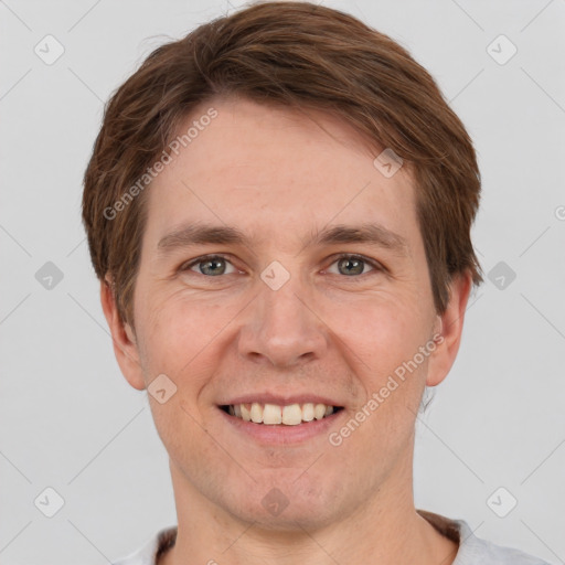 Joyful white adult male with short  brown hair and grey eyes