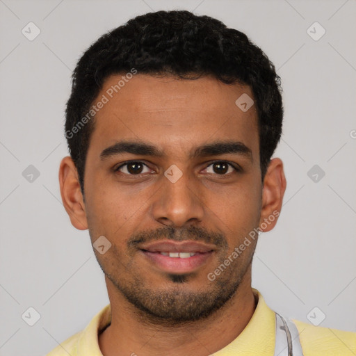 Joyful latino young-adult male with short  black hair and brown eyes