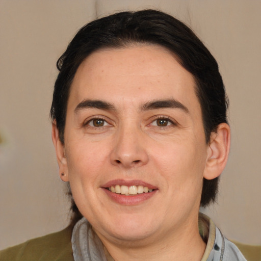 Joyful white adult male with medium  brown hair and brown eyes