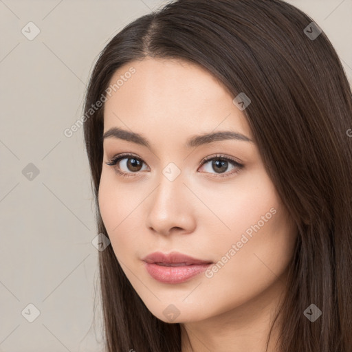 Neutral white young-adult female with long  brown hair and brown eyes