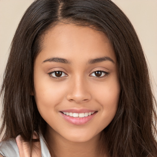 Joyful white young-adult female with long  brown hair and brown eyes