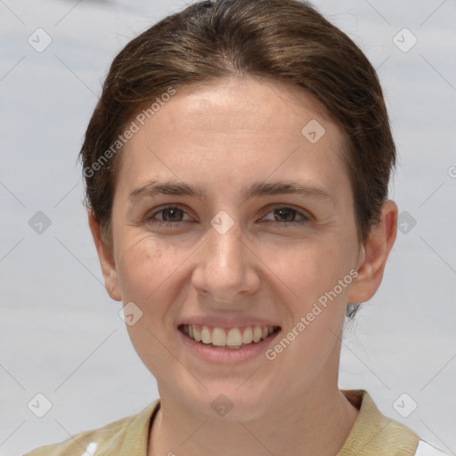 Joyful white young-adult female with short  brown hair and grey eyes