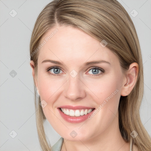 Joyful white young-adult female with long  brown hair and blue eyes