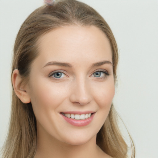 Joyful white young-adult female with long  brown hair and grey eyes