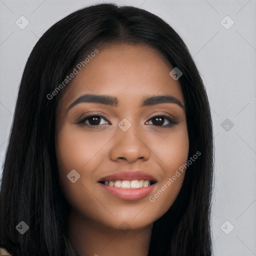 Joyful latino young-adult female with long  black hair and brown eyes