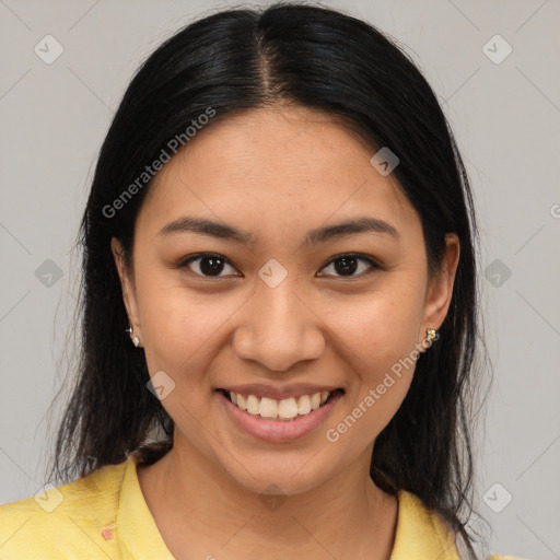 Joyful latino young-adult female with medium  brown hair and brown eyes