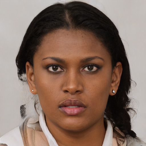 Neutral black young-adult female with medium  brown hair and brown eyes