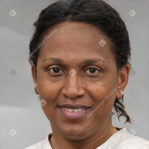 Joyful black adult female with short  brown hair and brown eyes