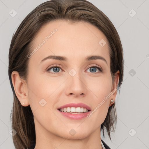 Joyful white young-adult female with medium  brown hair and grey eyes